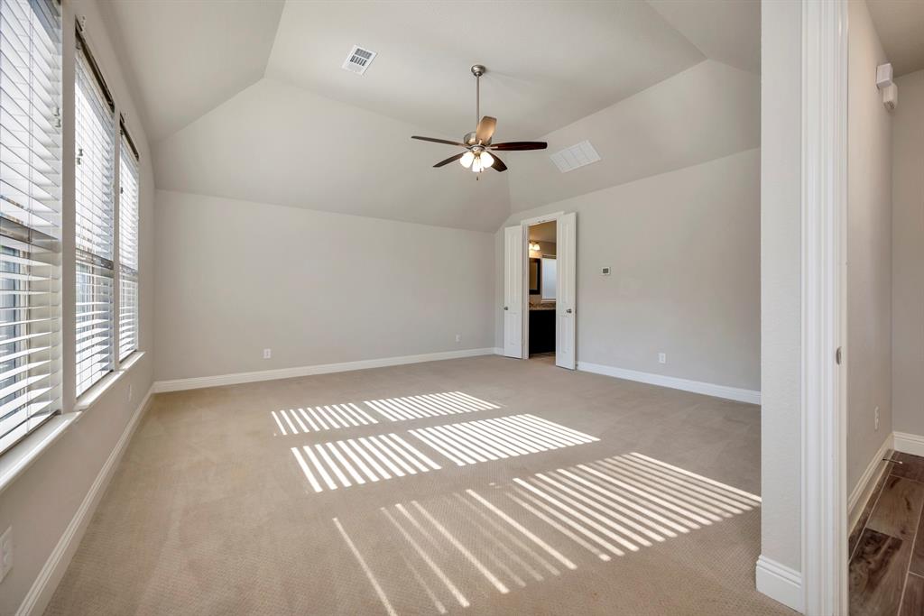 9820 Surveyor Road Little Elm, TX 75068 - Photo 15 of 40 a view of an empty room with a window