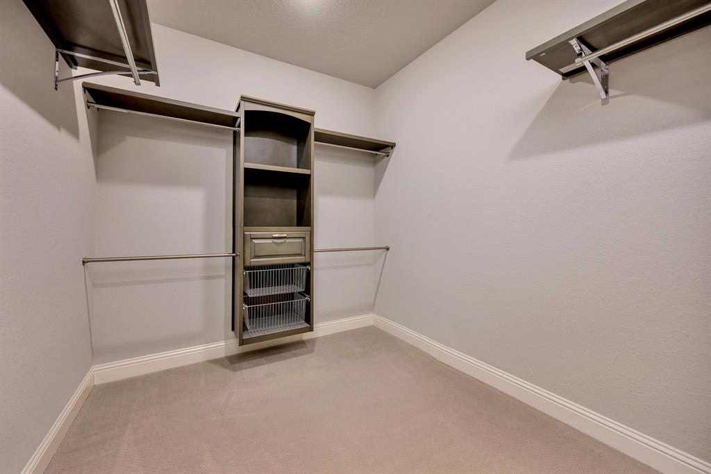 9820 Surveyor Road Little Elm, TX 75068 - Photo 21 of 40 a view of an empty walk in closet