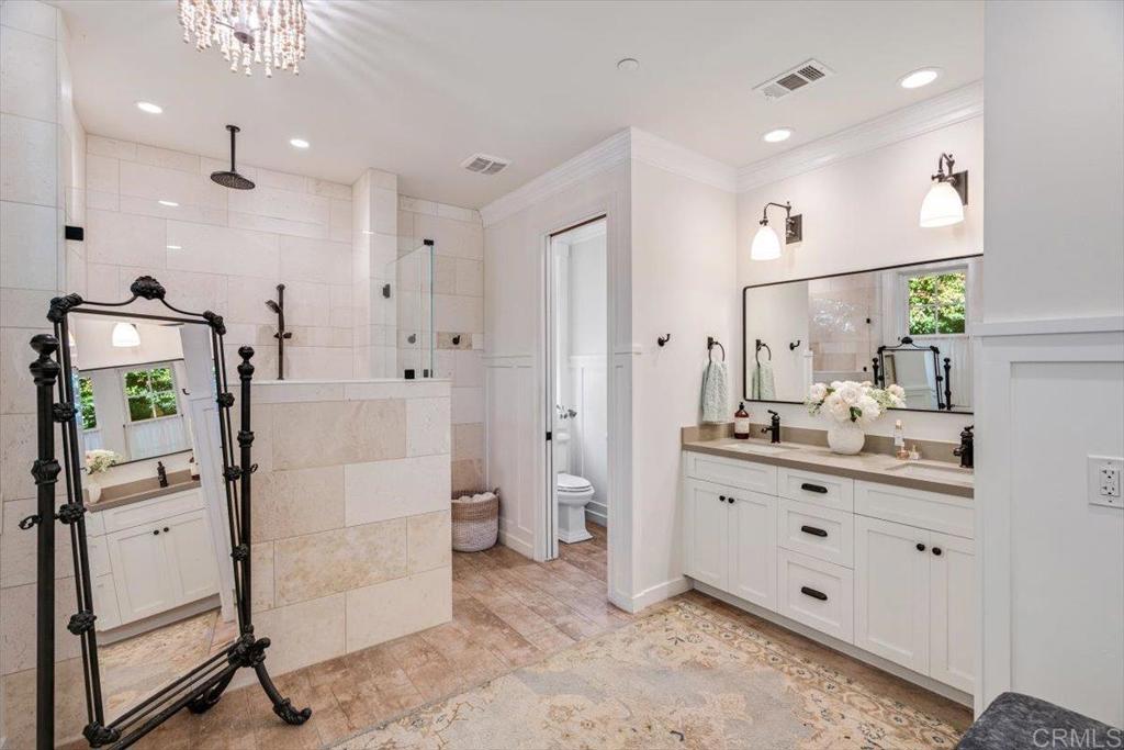 162 Jupiter Street Encinitas, CA 92024 - Photo 12 of 31 a spacious bathroom with a double vanity sink a mirror and shower