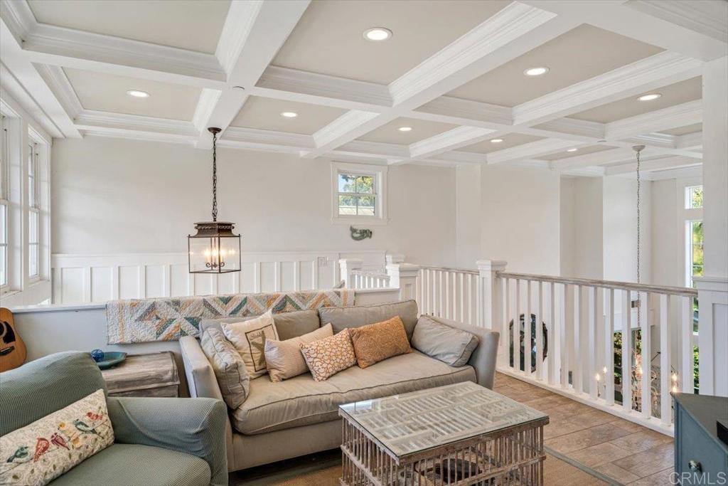 162 Jupiter Street Encinitas, CA 92024 - Photo 16 of 31 a living room with furniture a rug and a chandelier