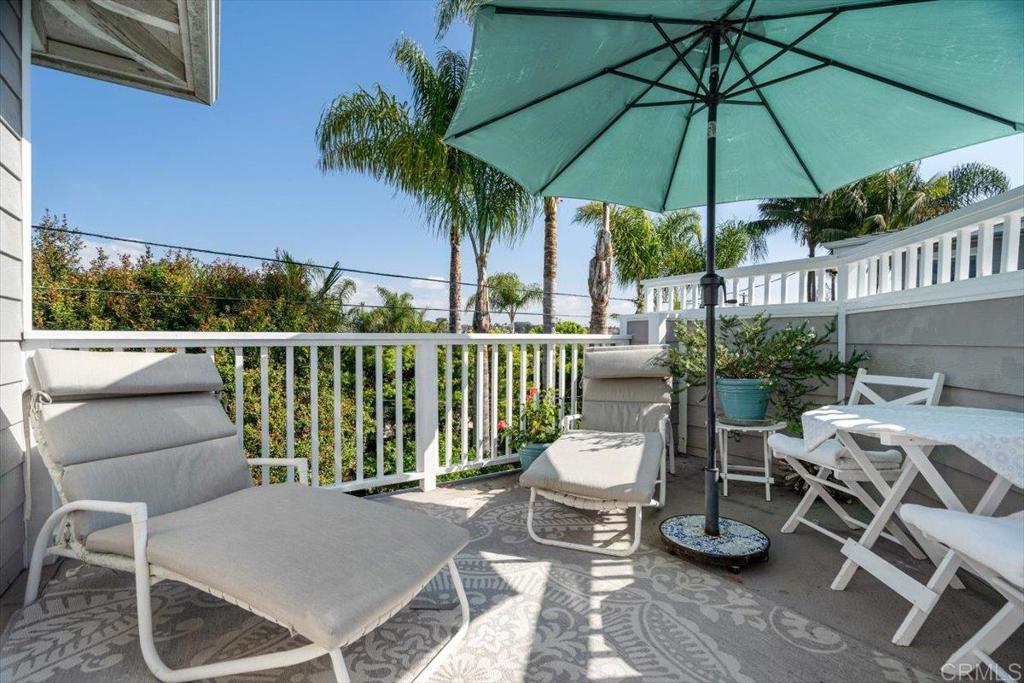 162 Jupiter Street Encinitas, CA 92024 - Photo 20 of 31 a view of a patio with a table chairs and a barbeque