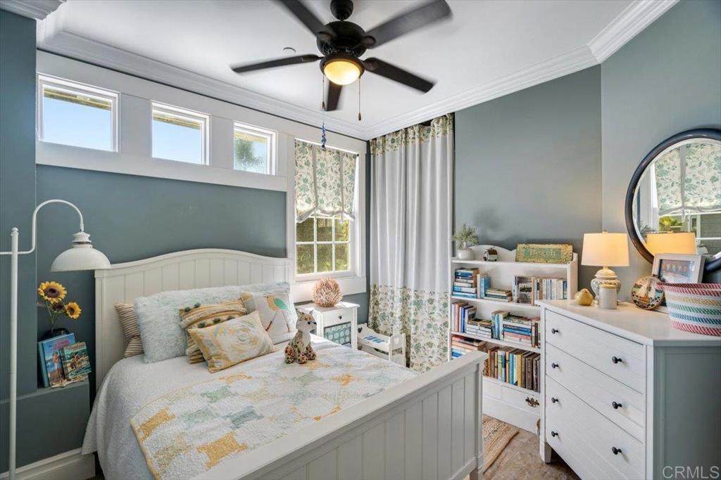 162 Jupiter Street Encinitas, CA 92024 - Photo 22 of 31 a bedroom with a bed and a chandelier