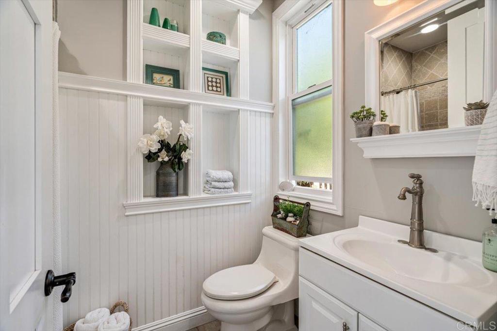 162 Jupiter Street Encinitas, CA 92024 - Photo 26 of 31 a bathroom with a toilet a sink and mirror