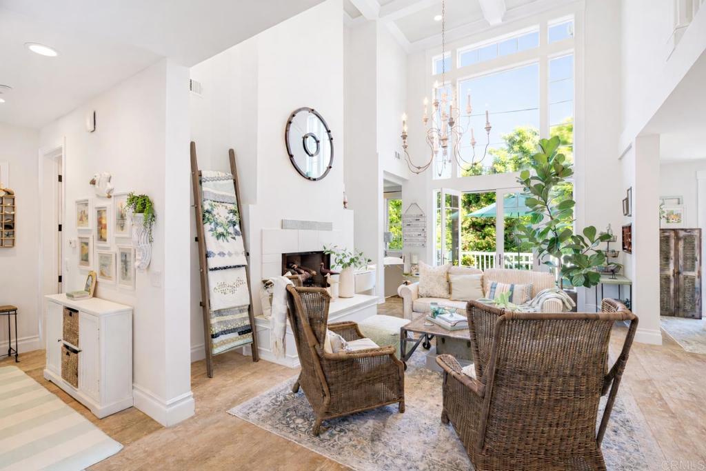 162 Jupiter Street Encinitas, CA 92024 - Photo 3 of 31 a living room with furniture a clock and a fireplace
