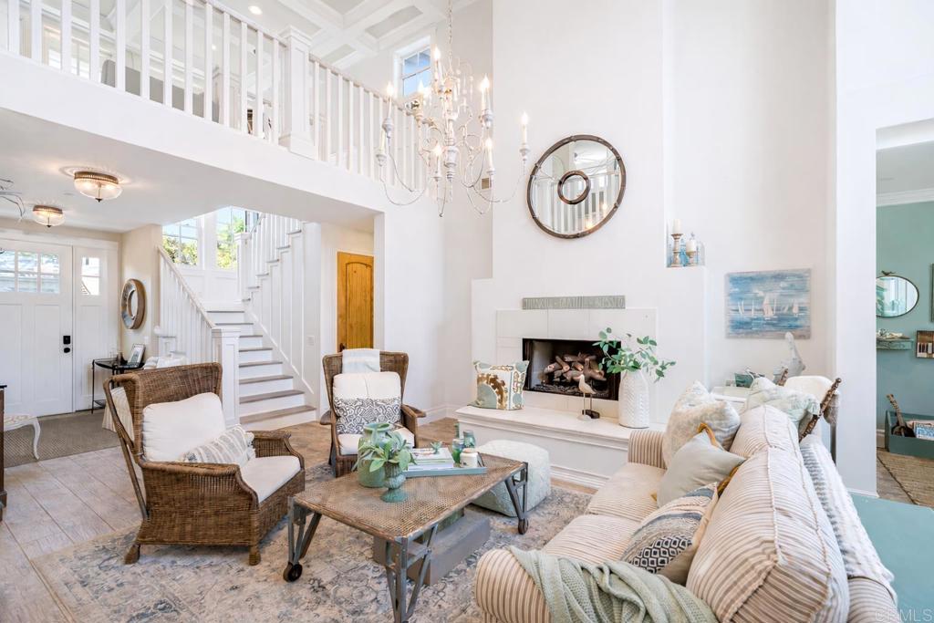 162 Jupiter Street Encinitas, CA 92024 - Photo 5 of 31 a living room with furniture a fireplace and a chandelier