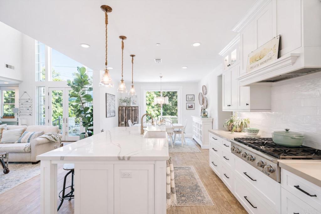 162 Jupiter Street Encinitas, CA 92024 - Photo 9 of 31 a kitchen with stainless steel appliances granite countertop a stove a sink and a refrigerator