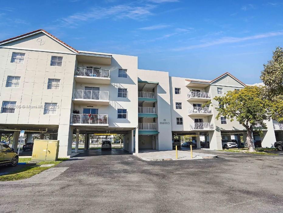 8260 Southwest 210th Street, Unit 302 Cutler Bay, FL 33189 - Photo 1 of 42 a view of building with street