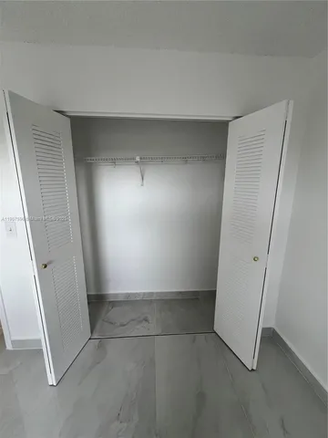 a view of a room with racks on the wall