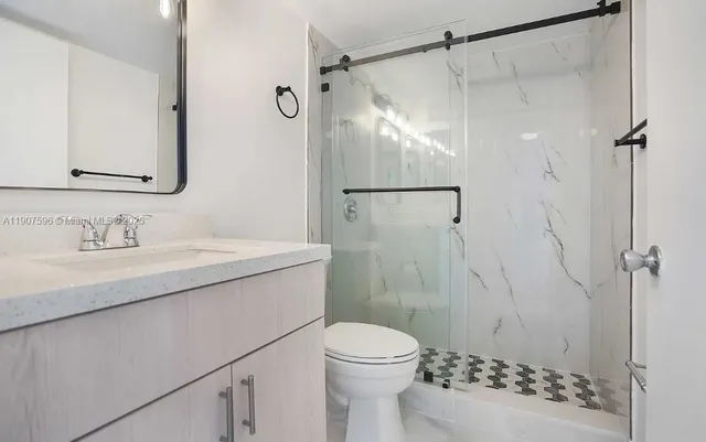 a view of an empty room and a window