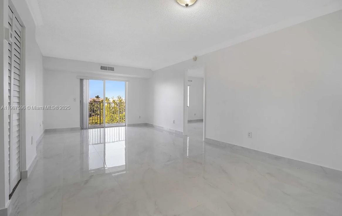 8260 Southwest 210th Street, Unit 302 Cutler Bay, FL 33189 - Photo 41 of 42 a view of an empty room and a window