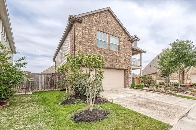 a view of a building with a yard