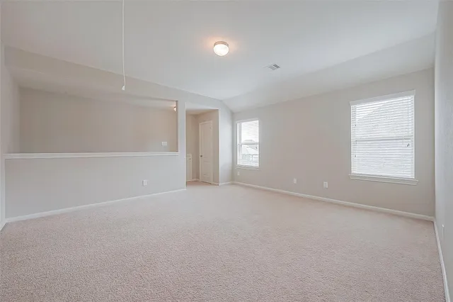 a view of a balcony with wooden floor