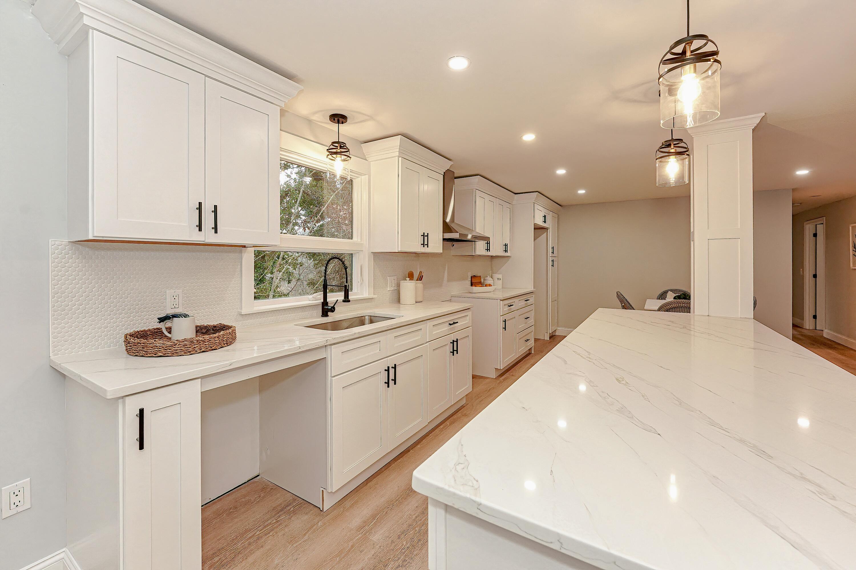 164 Katherine Road Centerville, MA 02632 - Photo 12 of 47 a kitchen with a sink stainless steel appliances and white cabinets