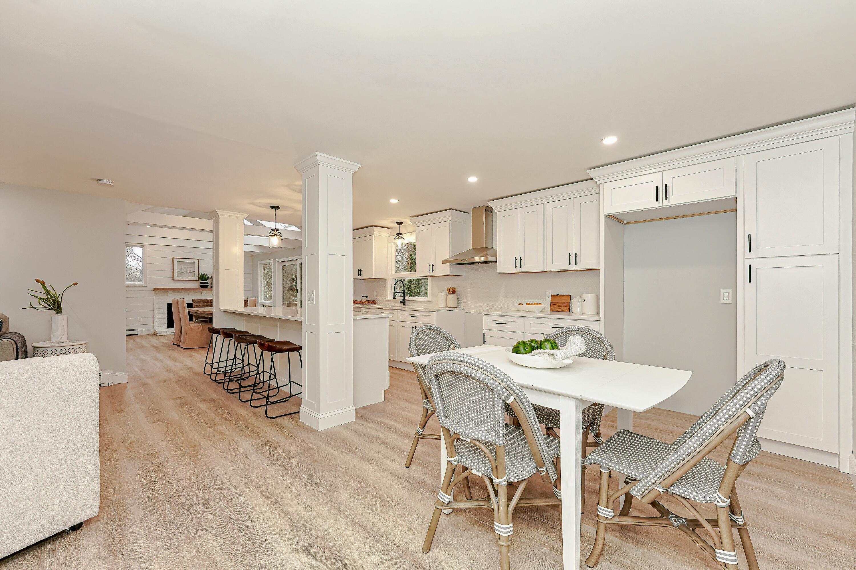 164 Katherine Road Centerville, MA 02632 - Photo 16 of 47 a view of a dining room with furniture and wooden floor