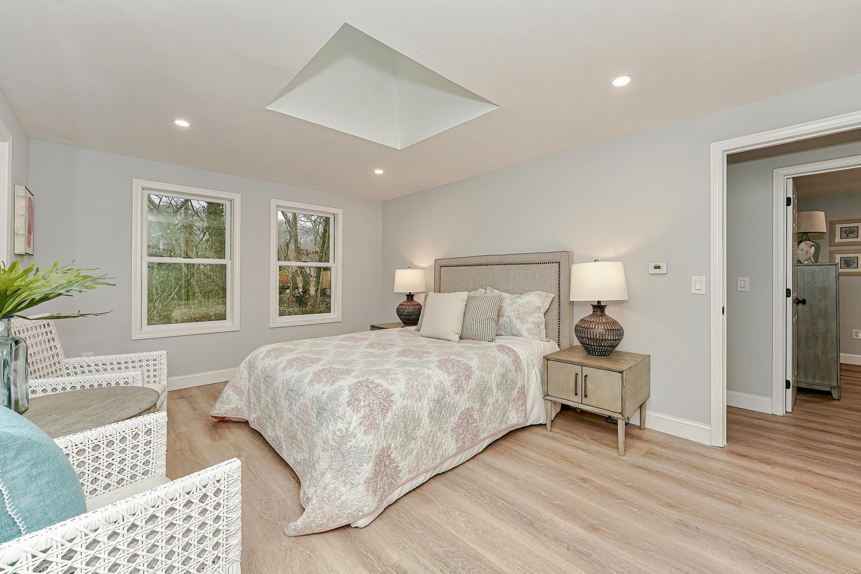 164 Katherine Road Centerville, MA 02632 - Photo 21 of 47 a bedroom with a bed and wooden floor