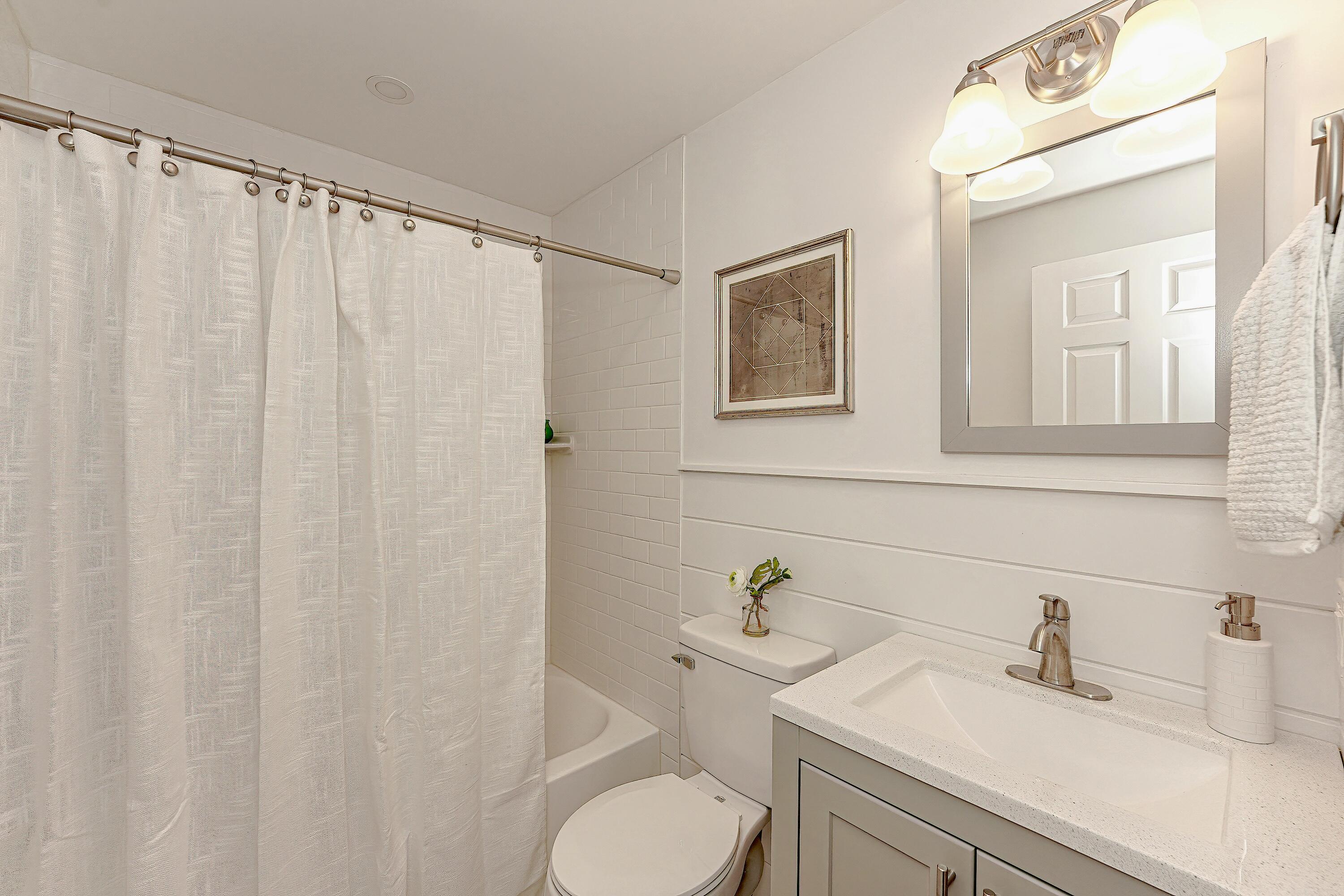 164 Katherine Road Centerville, MA 02632 - Photo 28 of 47 a bathroom with a sink vanity mirror and toilet