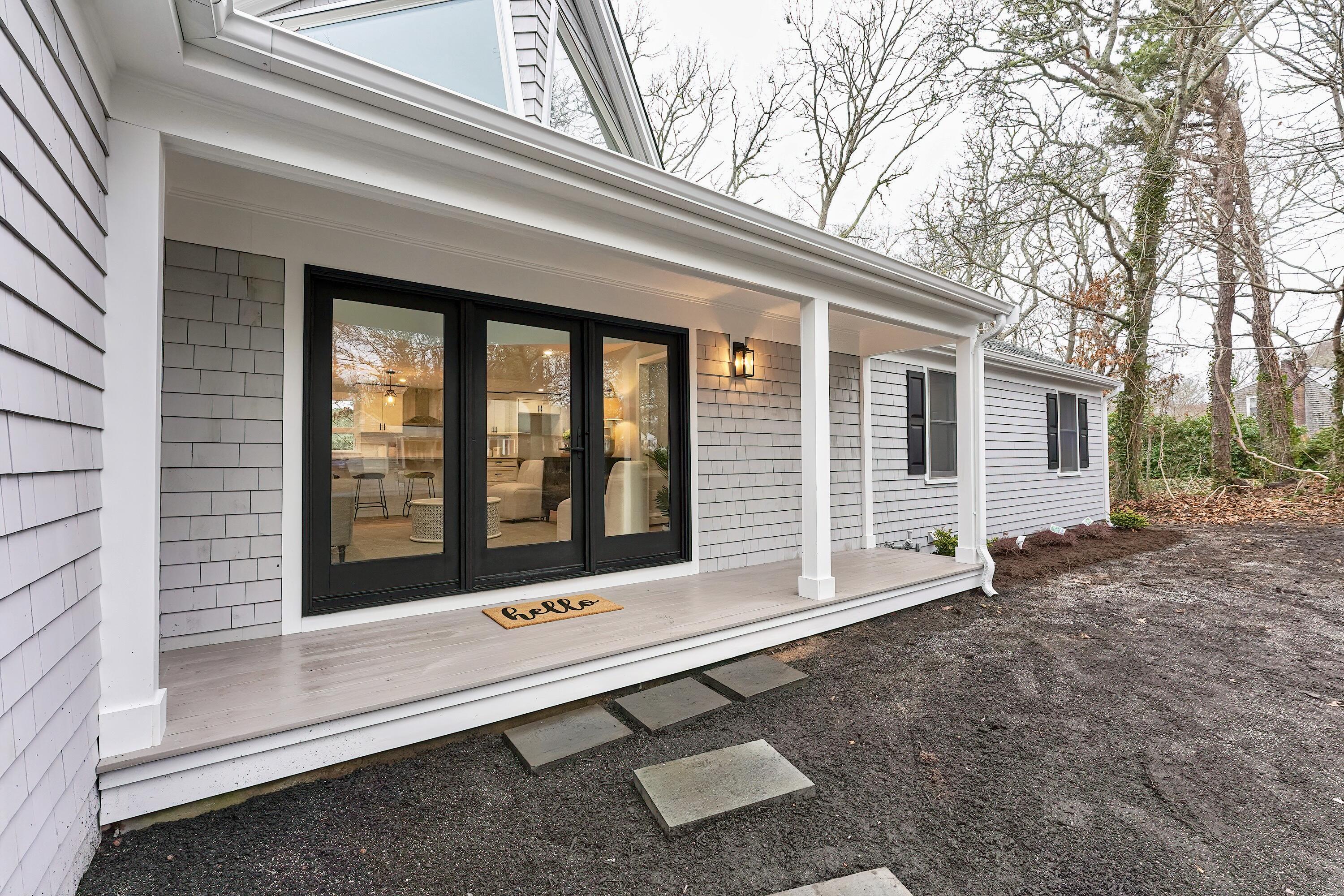 164 Katherine Road Centerville, MA 02632 - Photo 33 of 47 a view of backyard with large window and large tree
