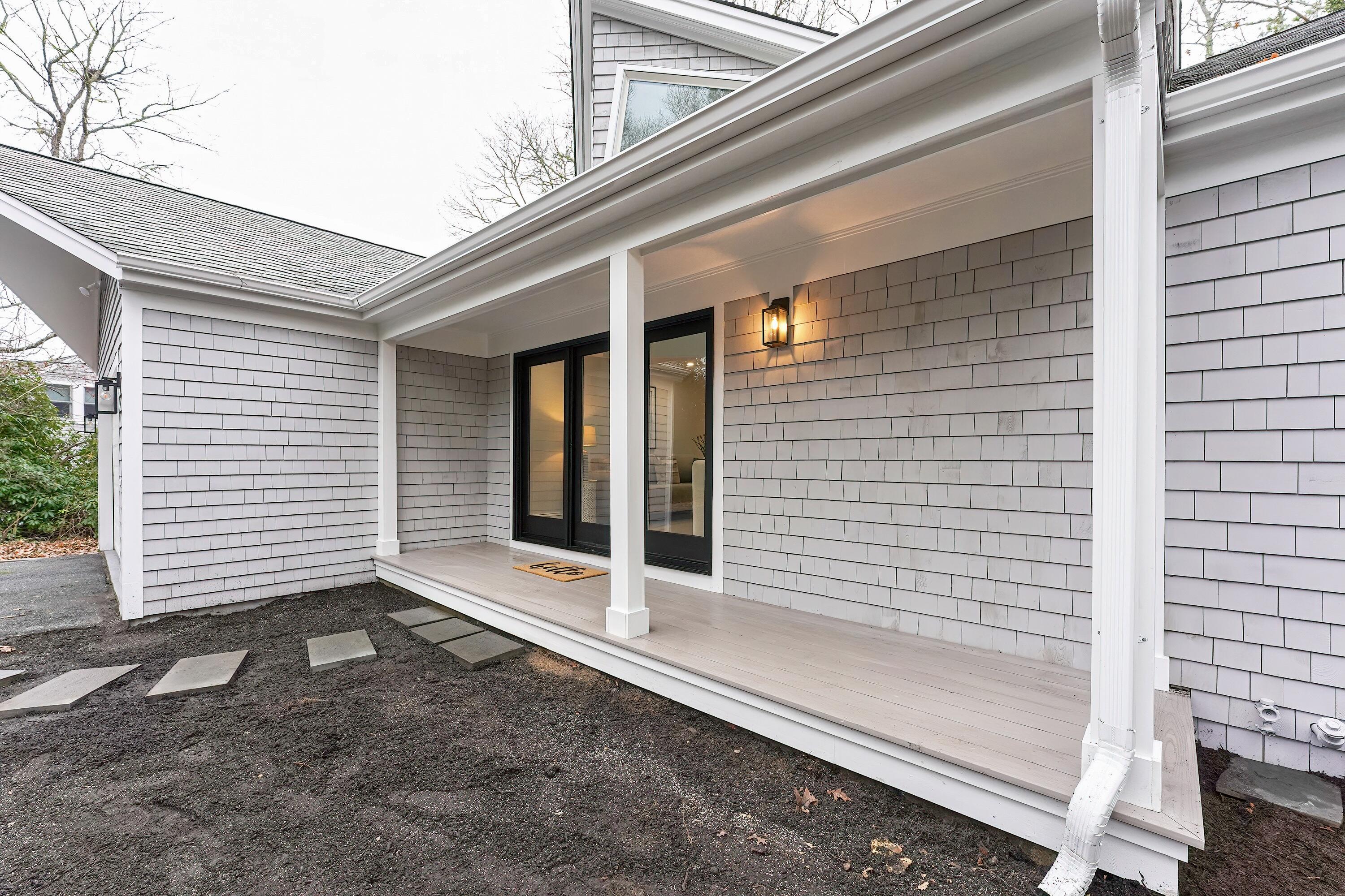 164 Katherine Road Centerville, MA 02632 - Photo 44 of 47 a view of a porch with a door