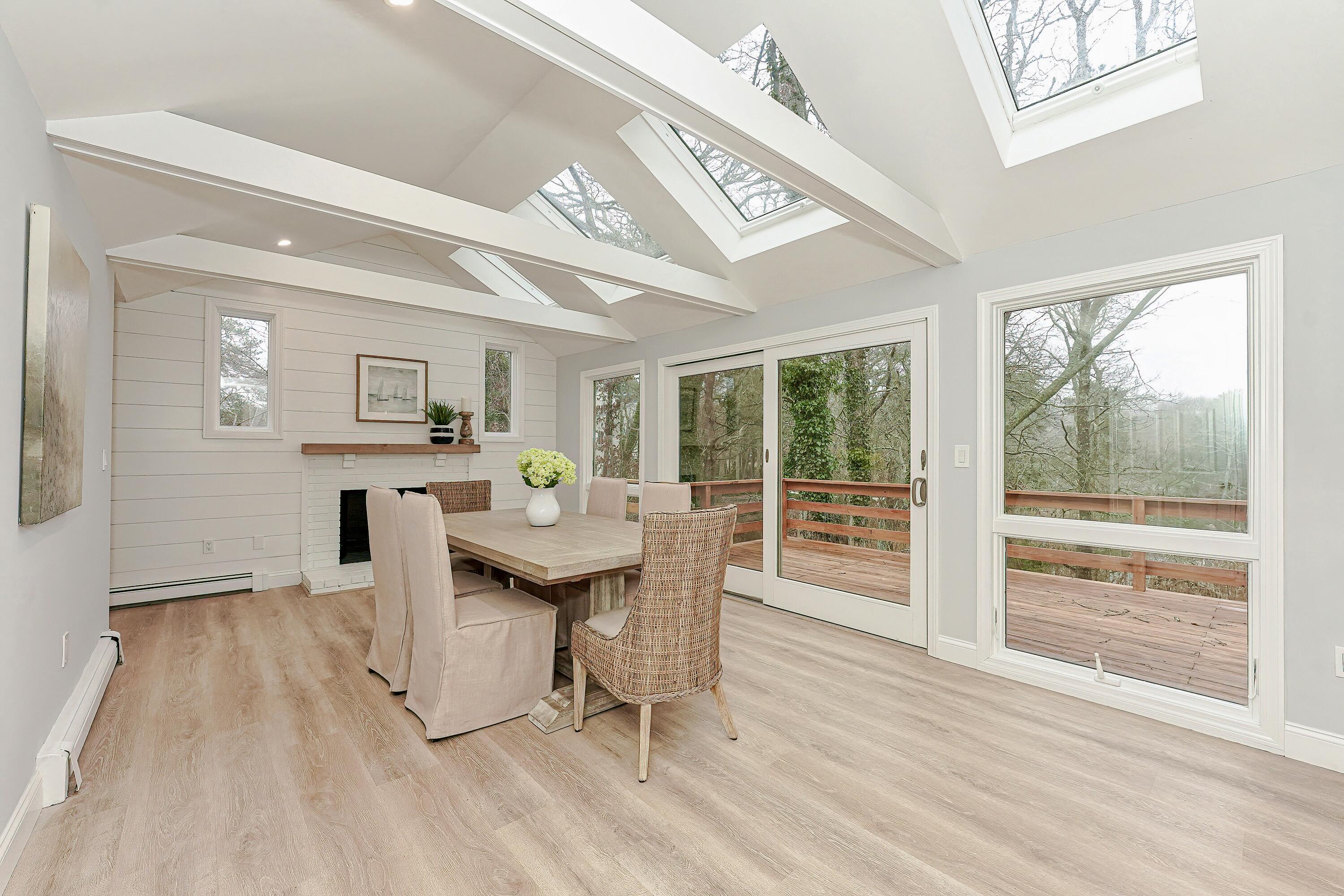 164 Katherine Road Centerville, MA 02632 - Photo 10 of 47 a view of a dining room with furniture window and wooden floor