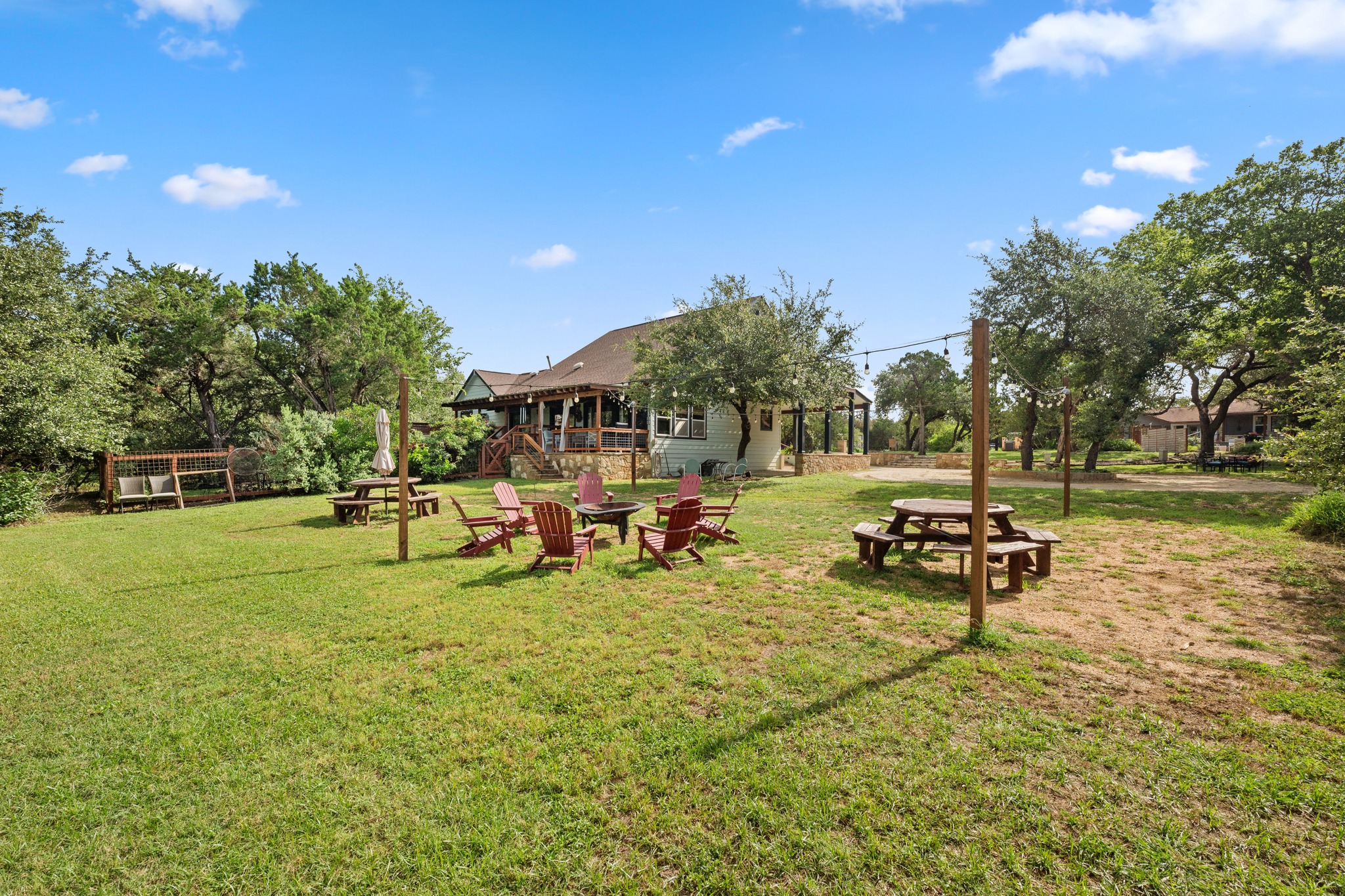 12932 Nutty Brown Road Austin, TX 78737 - Photo 12 of 40 The Cabin - Shared green space surrounded by mature trees and peaceful Hill Country scenery.