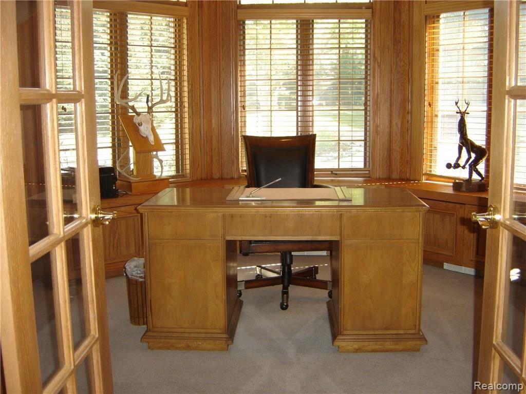 2829 Six Mile Road South Lyon, MI 48178 - Photo 26 of 46 Oak library/office with oak cabinets and book shelves.