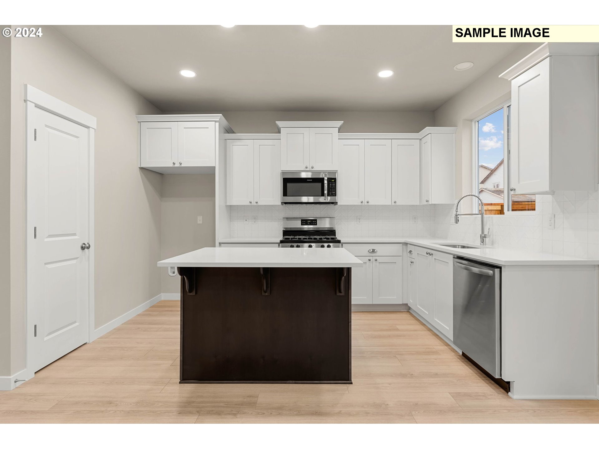 3135 South Nectarine Street Cornelius, OR 97113 - Photo 11 of 41 a kitchen with a sink cabinets and window