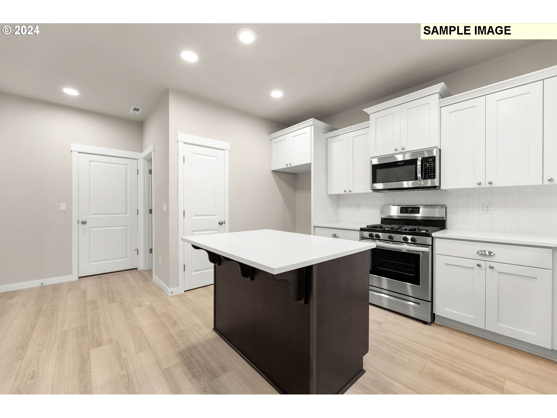 3135 South Nectarine Street Cornelius, OR 97113 - Photo 12 of 41 a kitchen with kitchen island a sink stainless steel appliances and cabinets