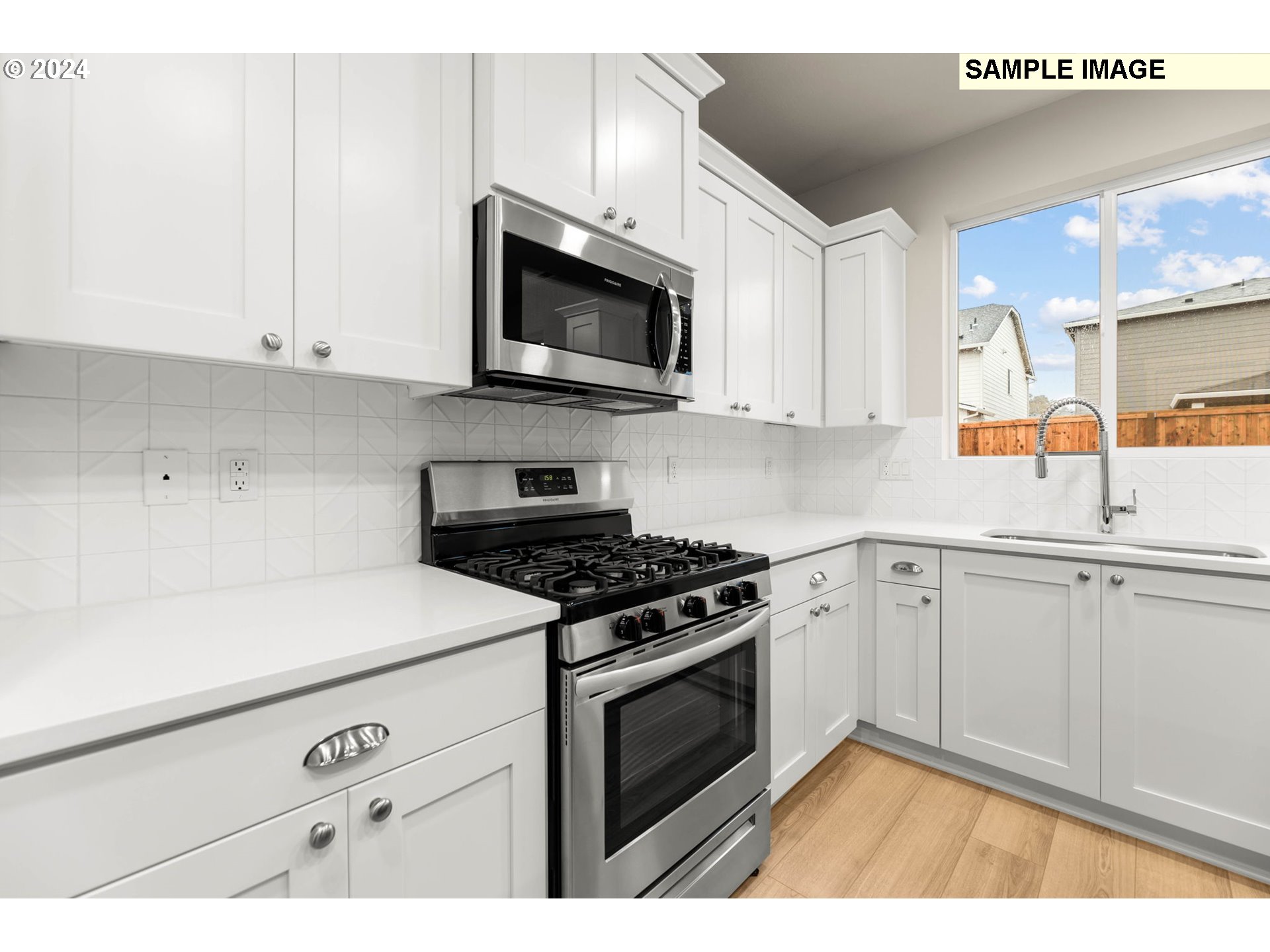 3135 South Nectarine Street Cornelius, OR 97113 - Photo 14 of 41 a kitchen with white cabinets and appliances