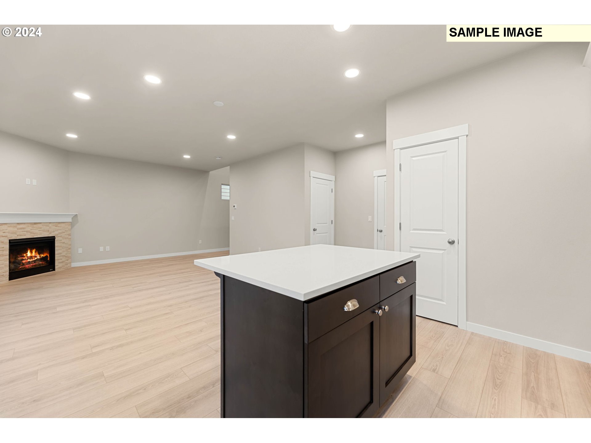 3135 South Nectarine Street Cornelius, OR 97113 - Photo 15 of 41 a kitchen with a wooden floor and a fireplace