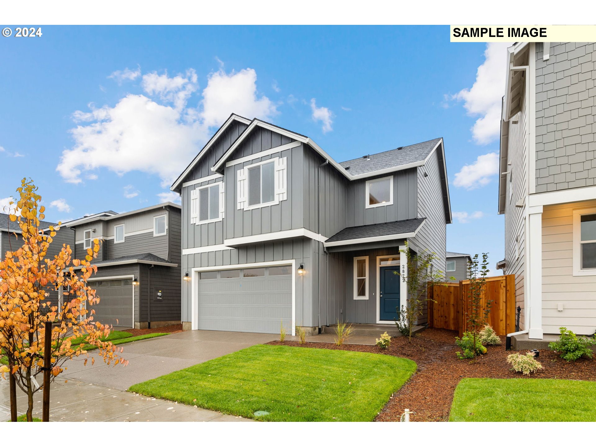 3135 South Nectarine Street Cornelius, OR 97113 - Photo 2 of 41 a front view of a house with a yard and garage