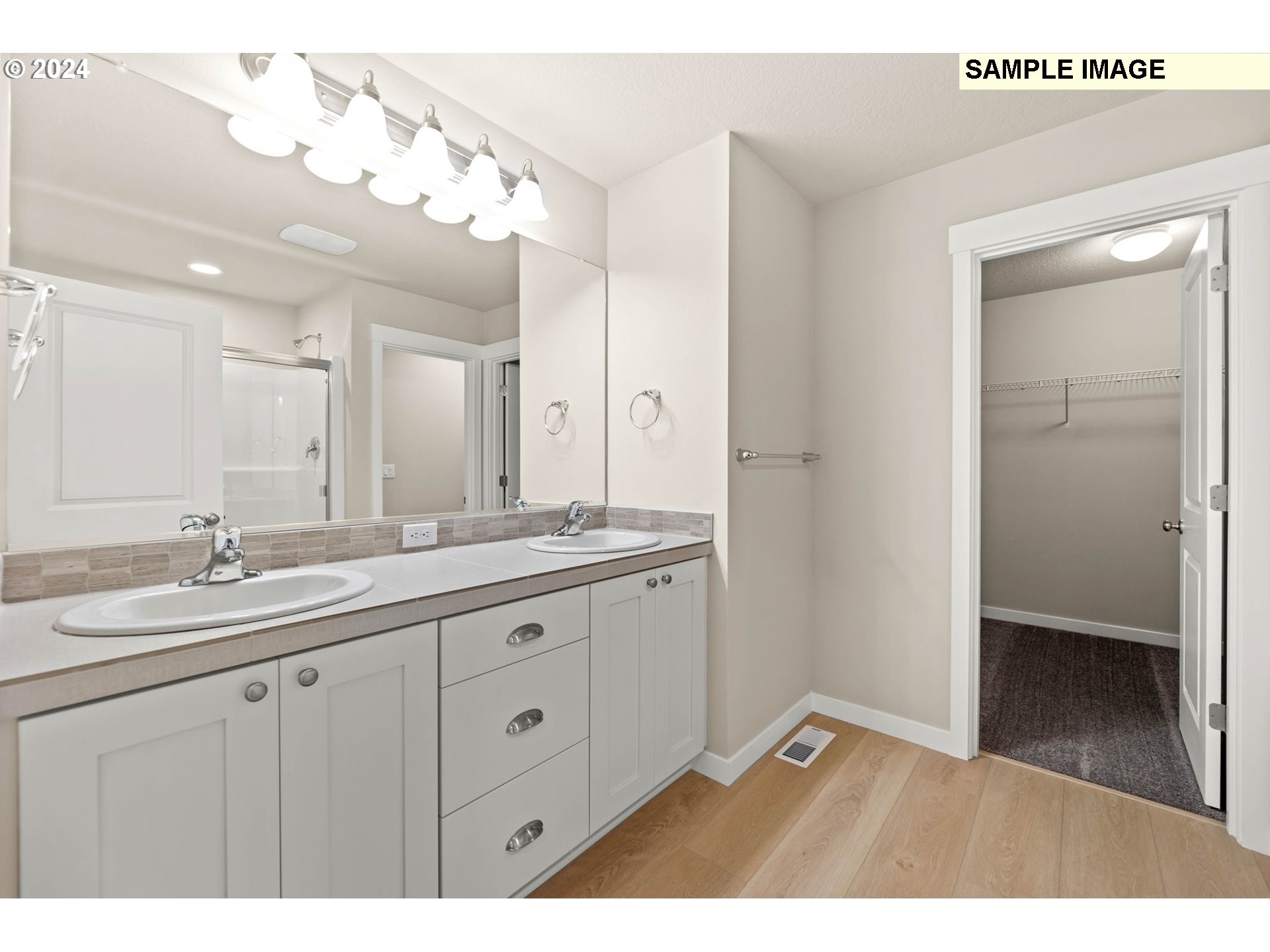 3135 South Nectarine Street Cornelius, OR 97113 - Photo 27 of 41 a bathroom with a double vanity sink and mirror