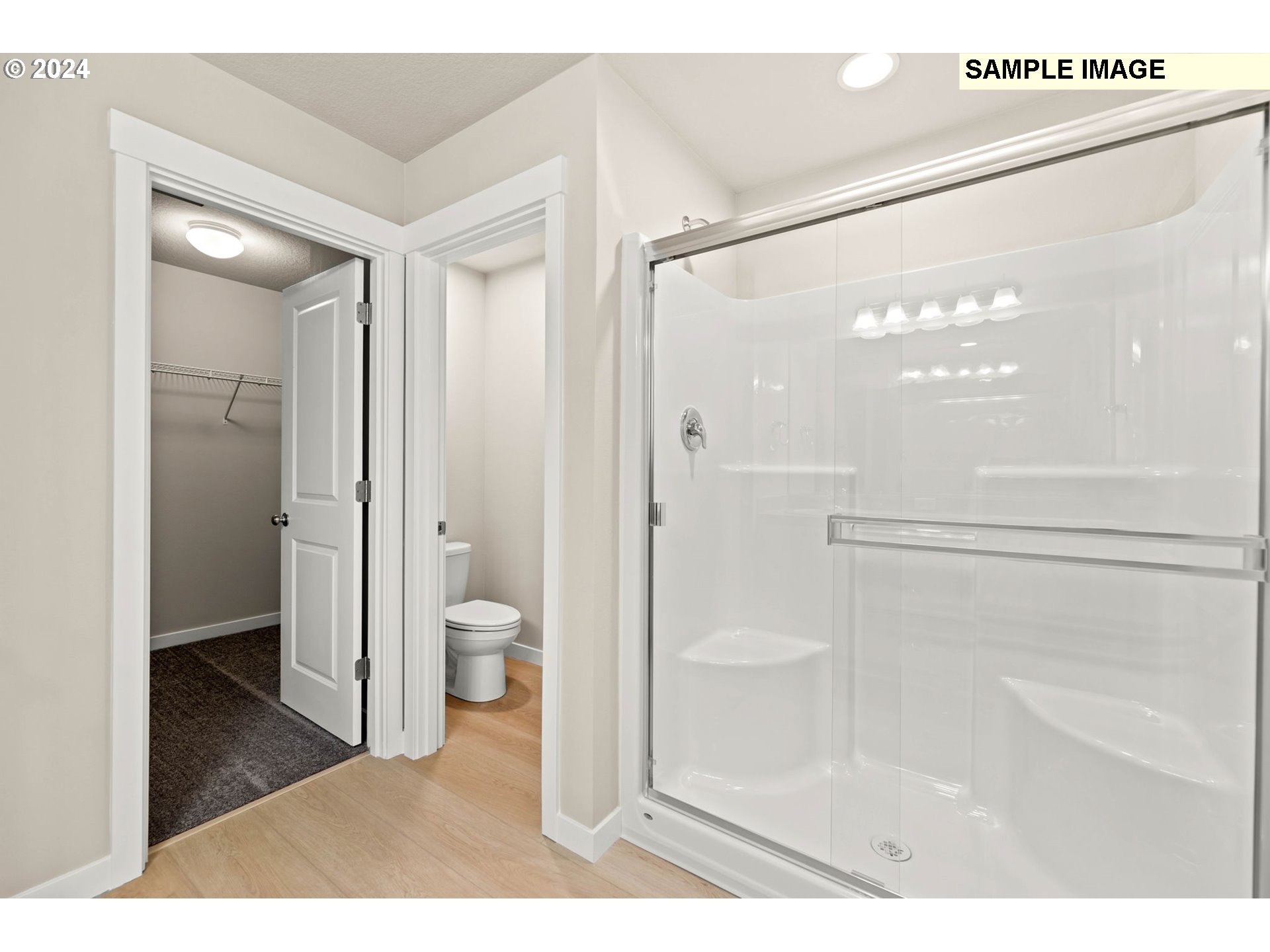 3135 South Nectarine Street Cornelius, OR 97113 - Photo 28 of 41 a bathroom with a glass shower door