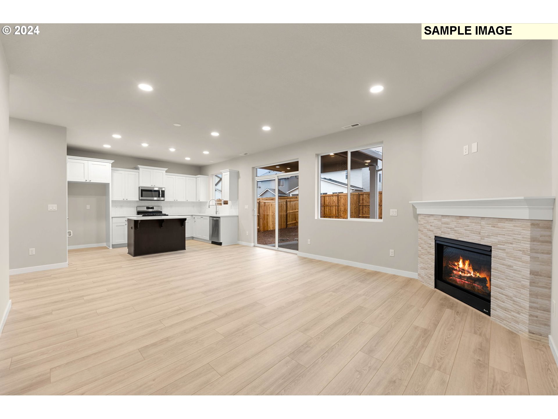 3135 South Nectarine Street Cornelius, OR 97113 - Photo 8 of 41 a view of kitchen and kitchen with a fireplace