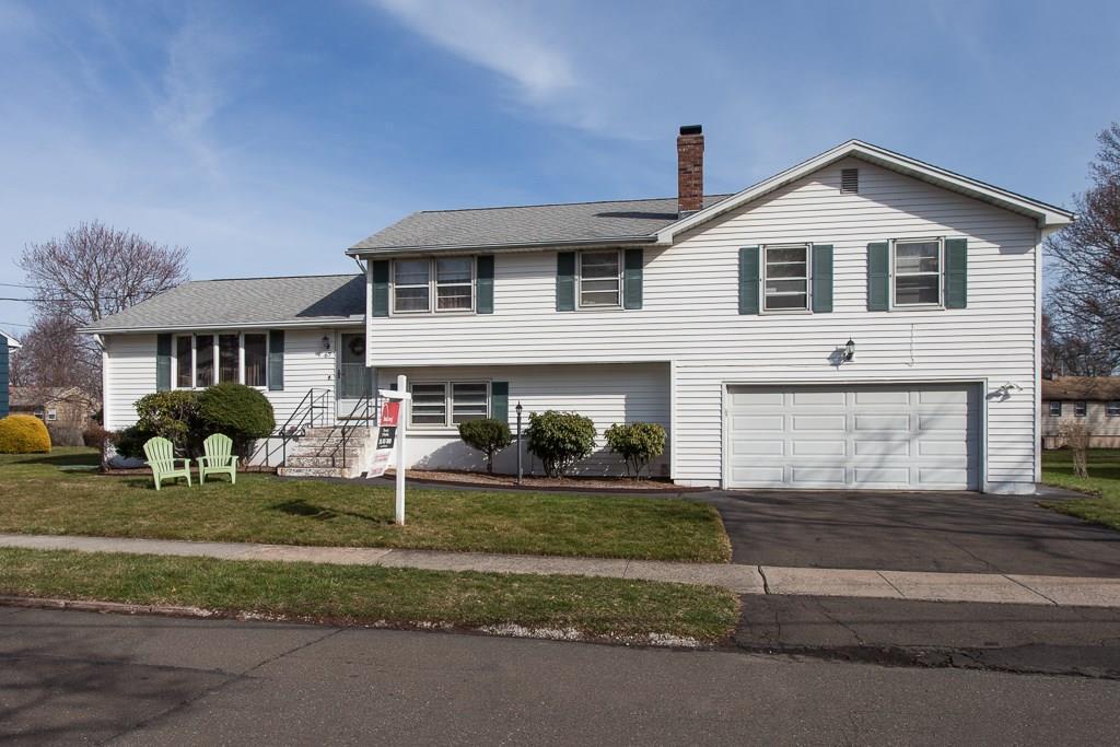 a front view of house with yard and outdoor seating