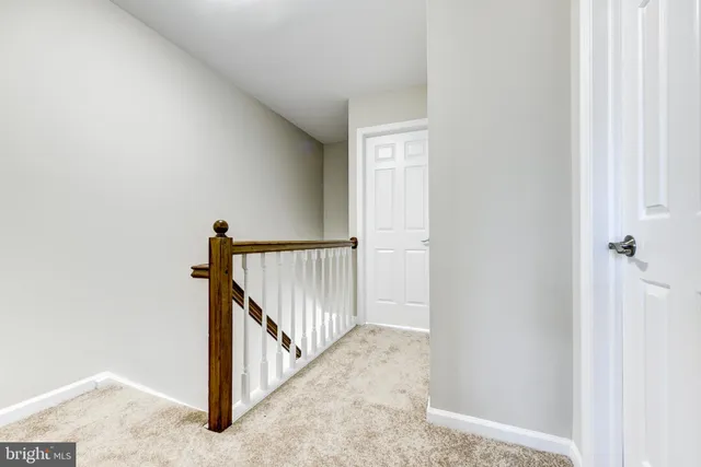 a view of a hallway view with staircase