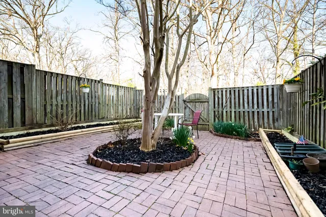 a view of a backyard with white house