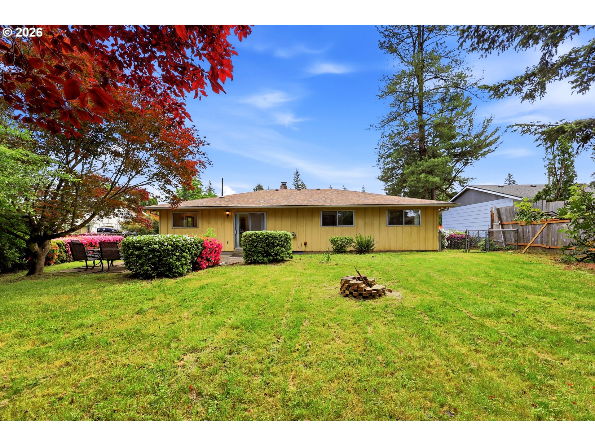 3003 Southeast 162nd Avenue Portland, OR 97236 - Photo 26 of 41 a front view of a house with a yard