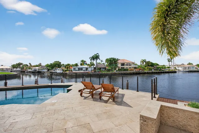 a view of a living room and a floor to ceiling window
