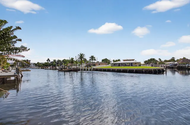 a bedroom with furniture and large windows