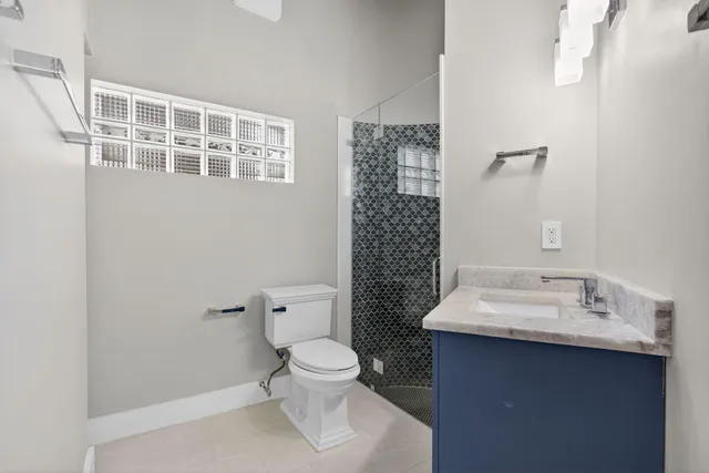 a large bedroom with a large bed and tv