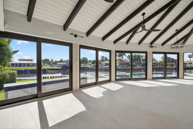 a view of swimming pool with outdoor seating and lake view