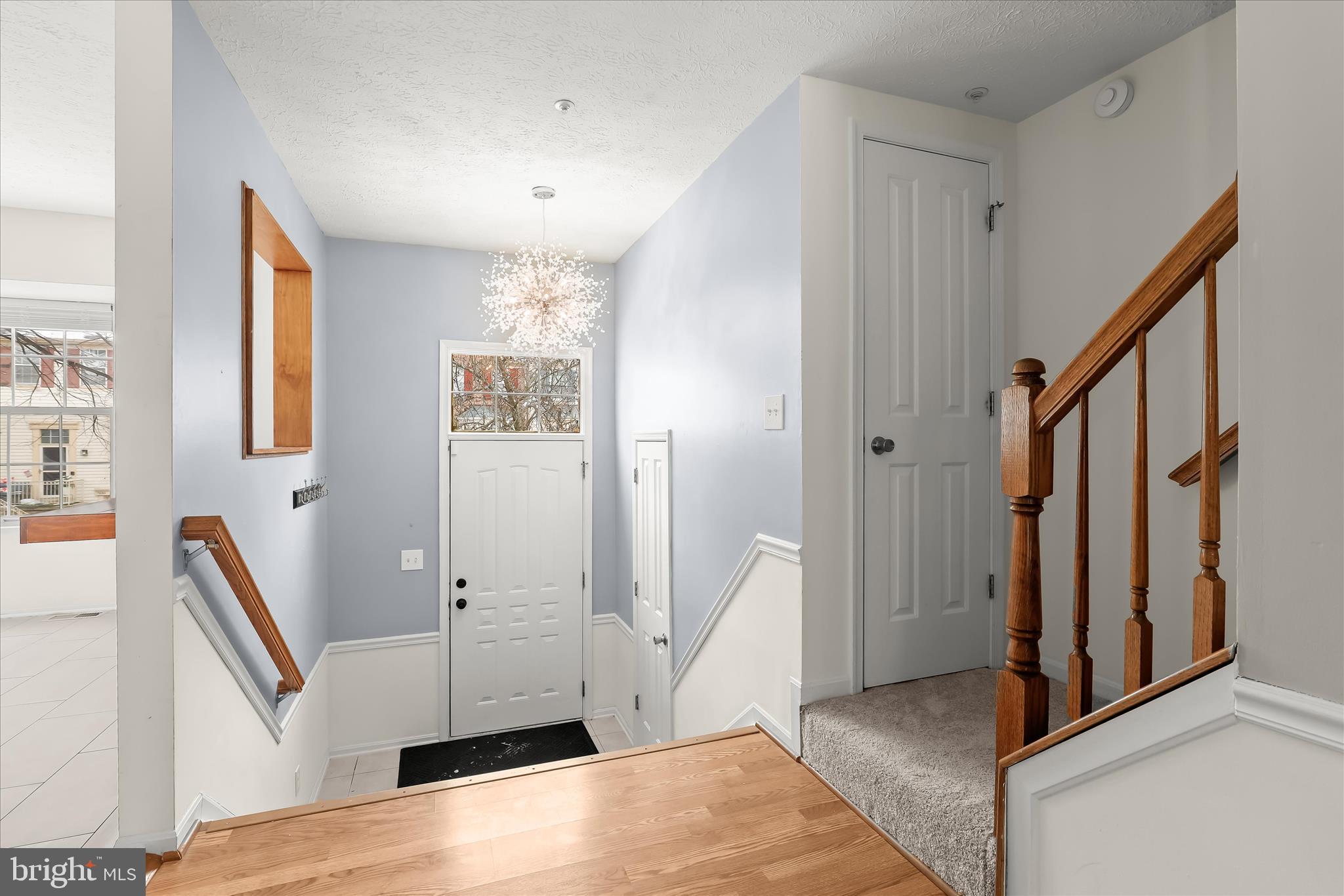 2567 Windy Oak Court Crofton, MD 21114 - Photo 13 of 52 a view of an entryway with wooden floor and stairs