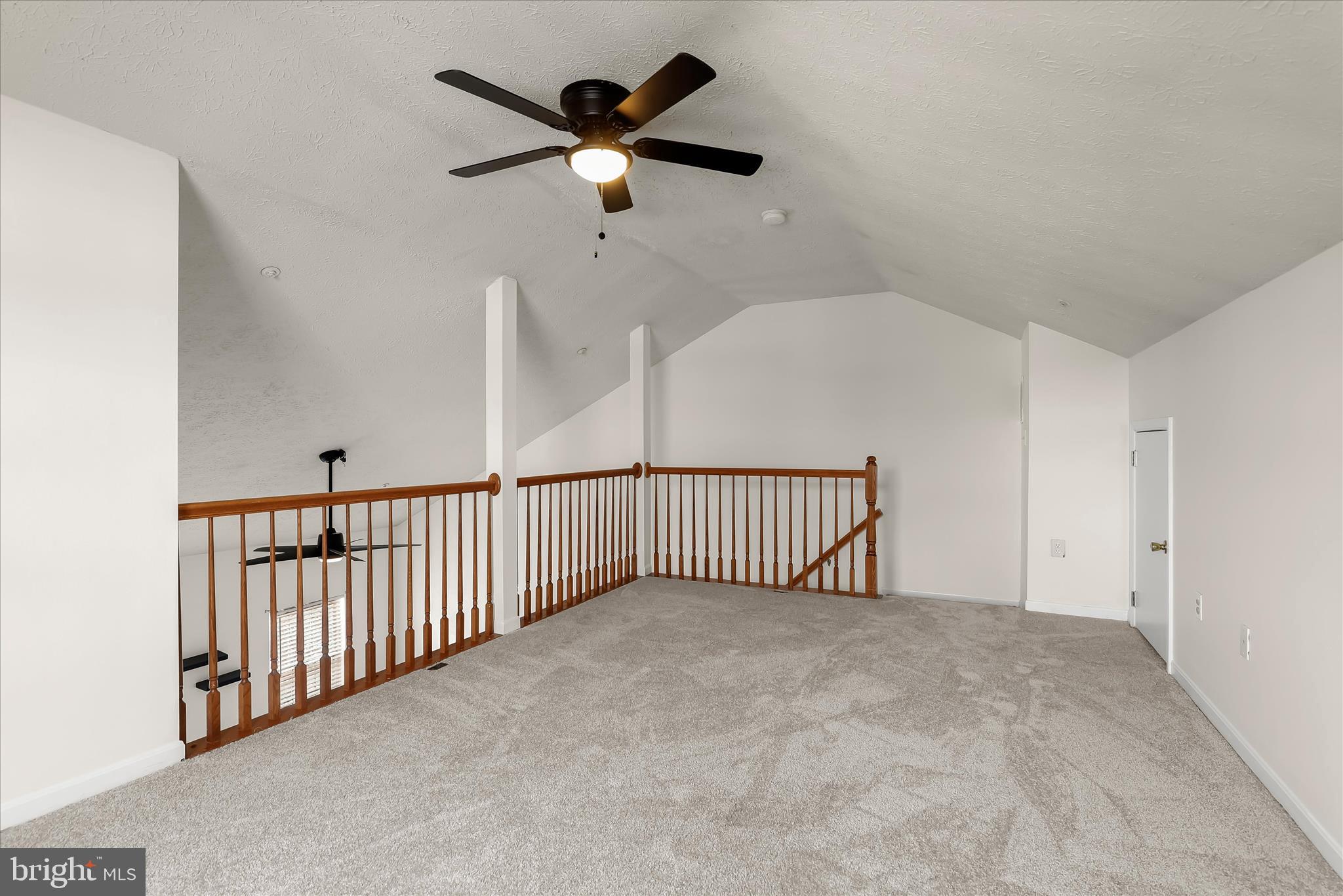 2567 Windy Oak Court Crofton, MD 21114 - Photo 22 of 52 a view of a hallway with a ceiling fan