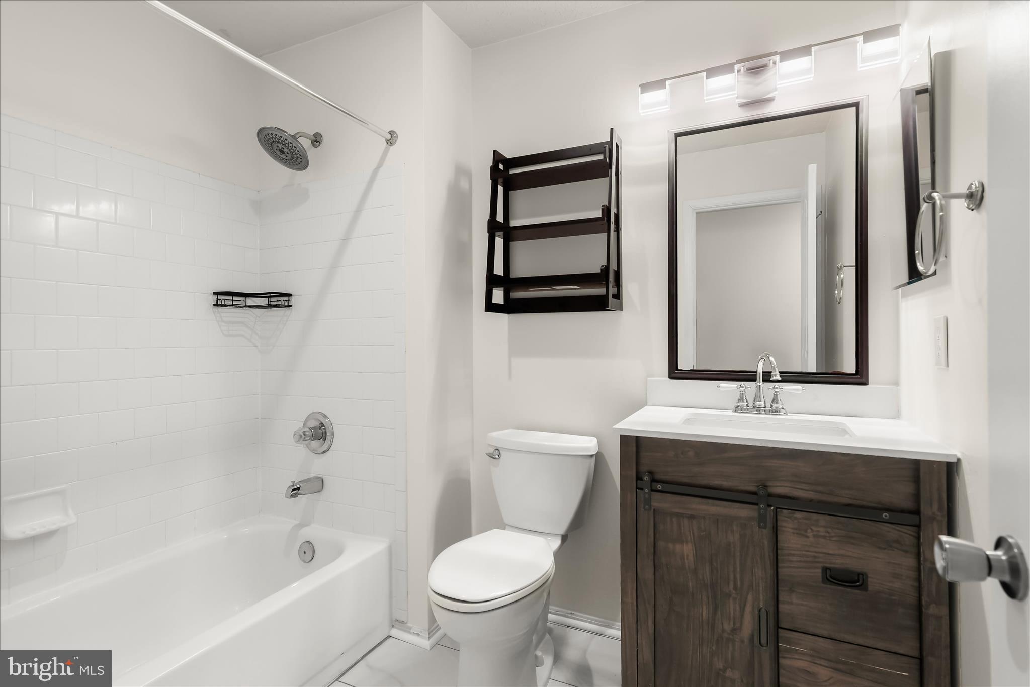 2567 Windy Oak Court Crofton, MD 21114 - Photo 28 of 52 a bathroom with a sink and a mirror