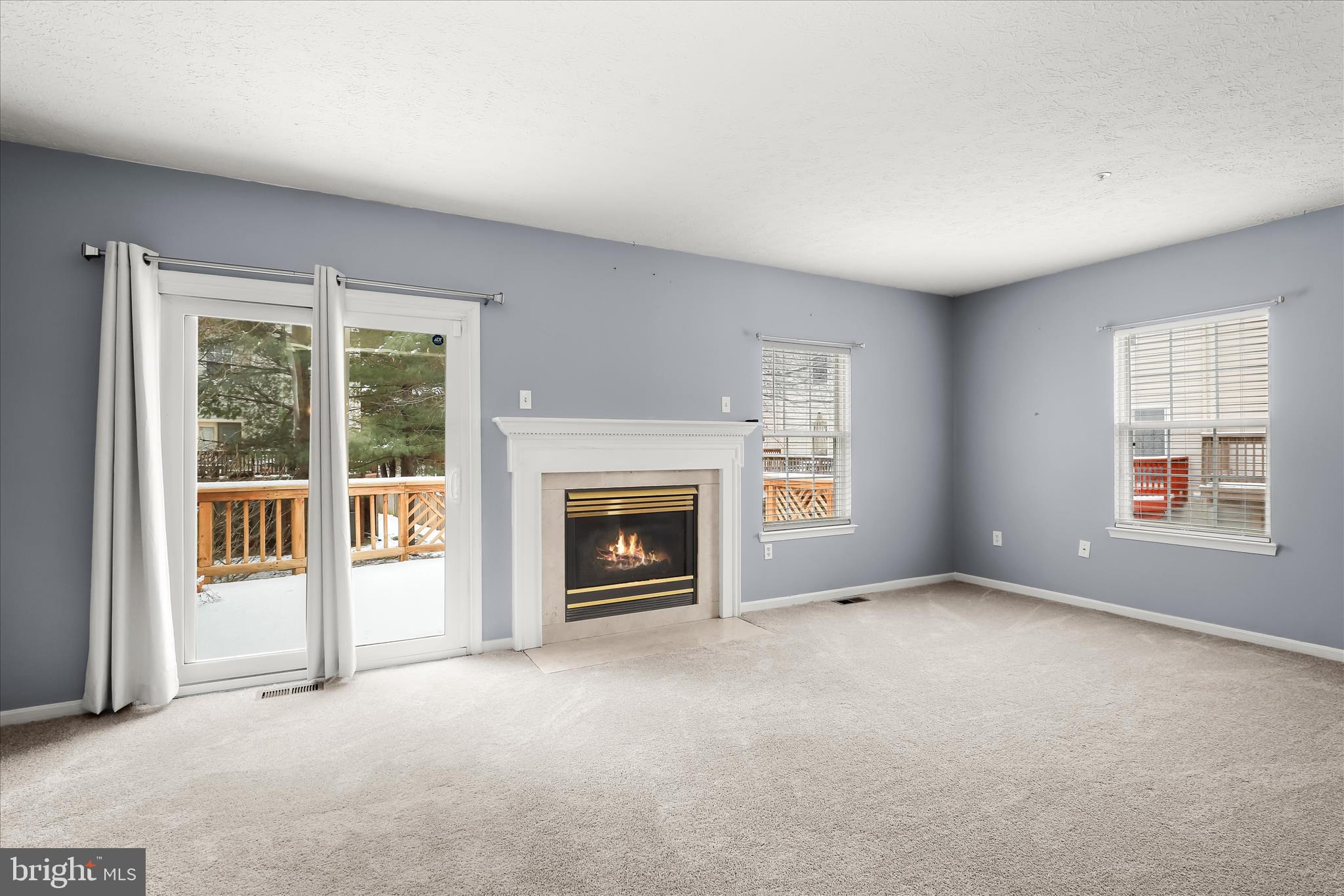 2567 Windy Oak Court Crofton, MD 21114 - Photo 3 of 52 a view of an empty room with a fireplace and a window
