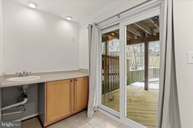 a bathroom with a shower and a sink