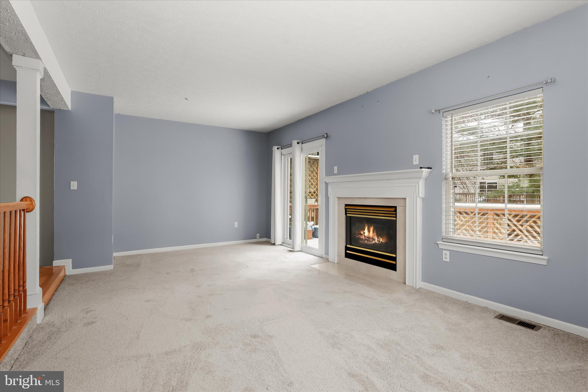 2567 Windy Oak Court Crofton, MD 21114 - Photo 4 of 52 a view of an empty room with a window and fireplace