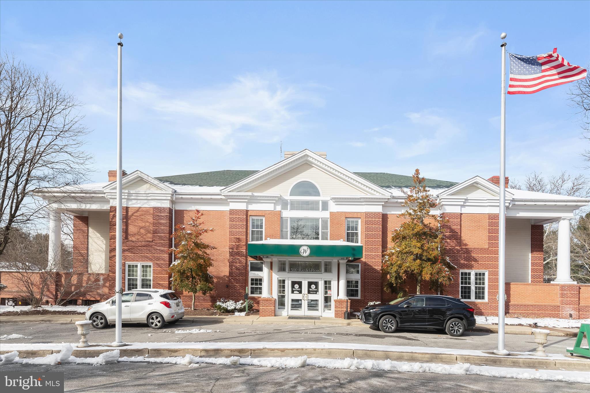 2567 Windy Oak Court Crofton, MD 21114 - Photo 46 of 52 a front view of a building with cars parked