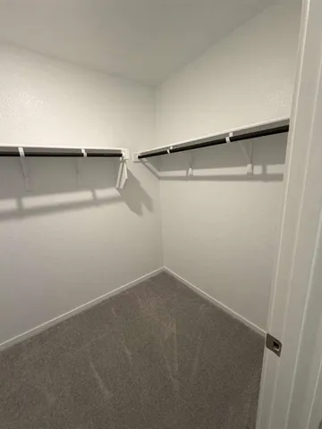 a view of an empty walk in closet