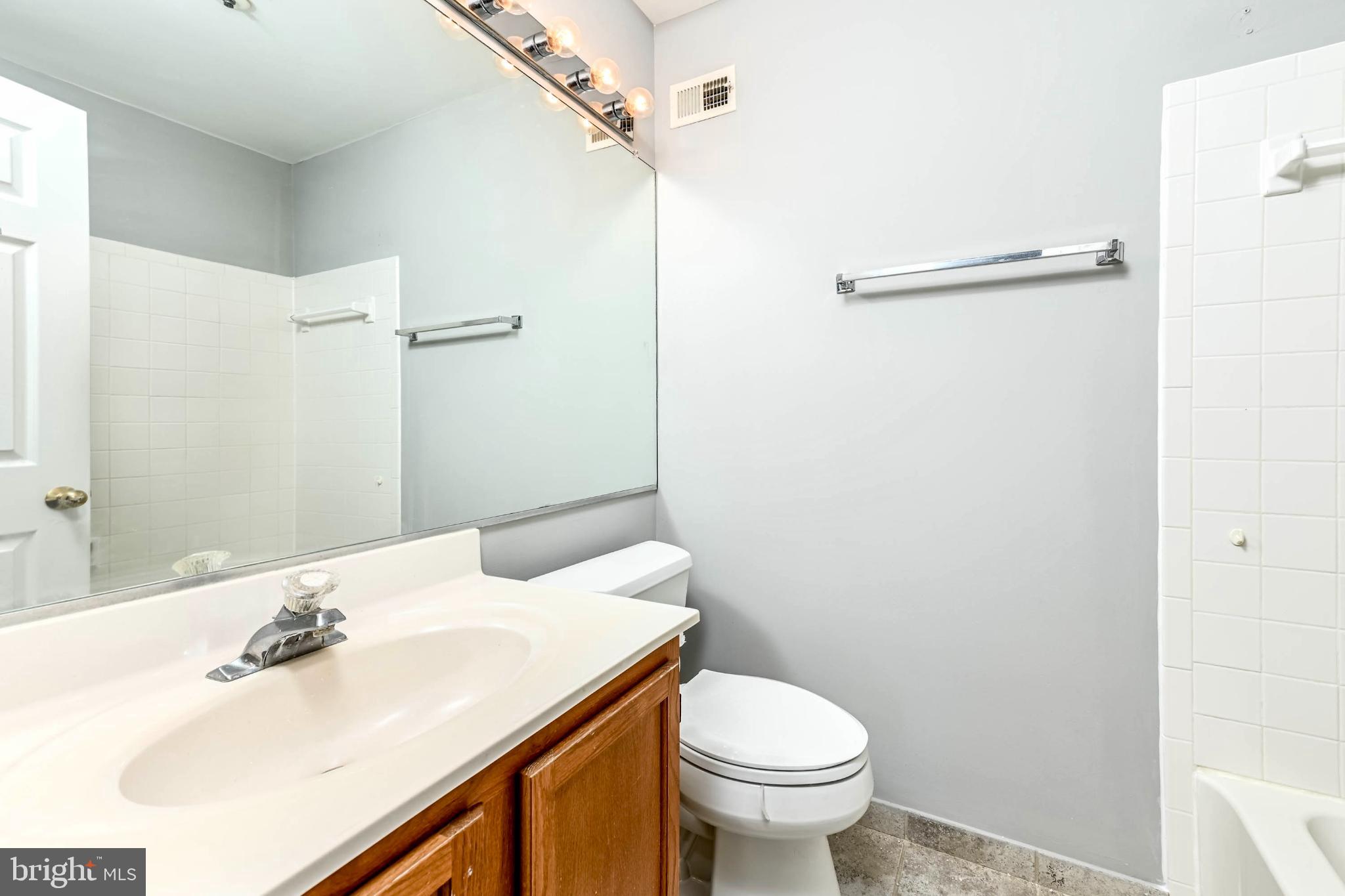 11152 Stagestone Way Manassas, VA 20109 - Photo 11 of 22 a bathroom with a sink toilet and shower
